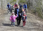 Community Services Minister Denise Peterson-Rafuse, who made the announcement of behalf of Energy Minister Charlie Parker, walks with children after the sustainable transportation announcement.