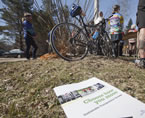 A copy of the strategy is on the ground in front of a bike during the announcement.