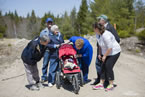 Community Services Minister Denise Peterson Rafuse, on behalf of Natural Resources Minister Charlie Parker, stops to chat with a young resident during a walk of the opened road.