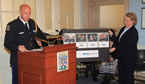 Chief Jean-Michel Blais, Halifax Regional Police, and Stephanie MacInnis- Langley executive director, Status of Women, displaying the Don't Be That Guy campaign posters