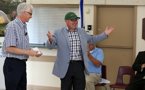 Premier Darrell Dexter wears a new ball cap with the name of the province's newest park on it.
