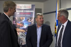 Labour and Advanced Education Minister Frank Corbett discusses recommendations to the apprenticeship system with  (left) Tom Griffiths, assistant business manager IBEW, Local 625  and (right) Brad Smith, executive director,  Mainland NS Building Trades Council.