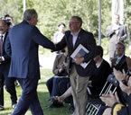 Premier Dexter shakes hands with Irving co-CEO Jim Irving.