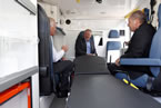 FROM LEFT: Tony Eden, director of EHS Ground Ambulance, Premier Darrell Dexter, and Keith Condon, president of Tri-Star Industries, chat one of the new ambulance.