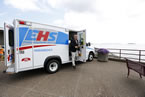 Health and Wellness Minister David Wilson steps out of one of the new ambulances.