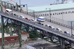 An ambulance drives across the Angus L. Macdonald Bridge.