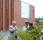 Premier Darrell Dexter stands in front of the Bloomfield Centre with Communities, Culture and Heritage Minister Leonard Preyra, Finance Minister Maureen MacDonald and others.