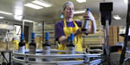 A worker at Van Dyk's in Caledonia, Queen's Co., checks a bottle of juice off the production line. The company ships its product worldwide from its Nova Scotia facility.