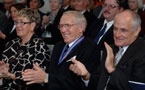 Cynthia Baker (from left), Mel Boutilier and John Duckworth applaud during the Order of Nova Scotia ceremony.