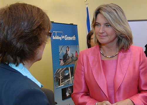 Education Minister Judy Streatch listens to a question after the announcement.