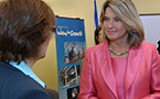 Education Minister Judy Streatch listens to a question after the announcement.