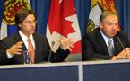 New Brunswick Premier Shawn Graham (left) and Premier Darrell Dexter (right) at Fredericton news conference (CNB photo)