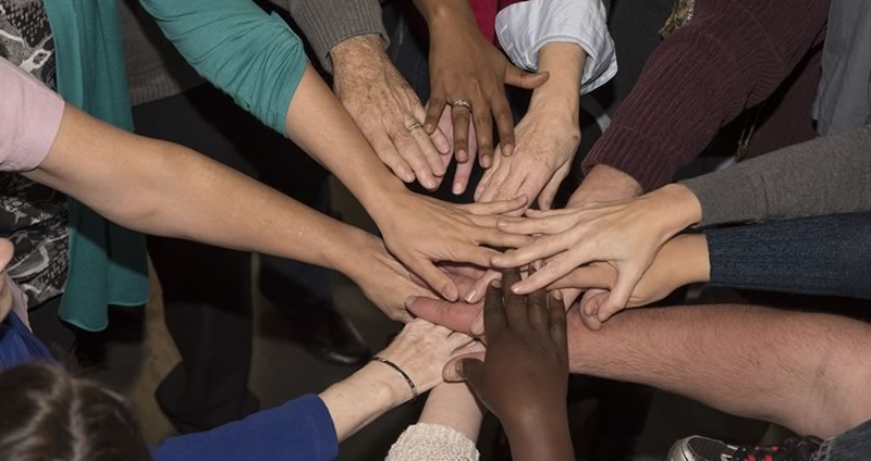 Several hands together