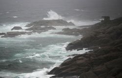 Waves pound Chebucto Head as Hurricane Bill nears Nova Scotia.